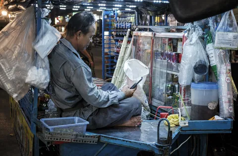 Drinks vendor on a break, Siem Reap