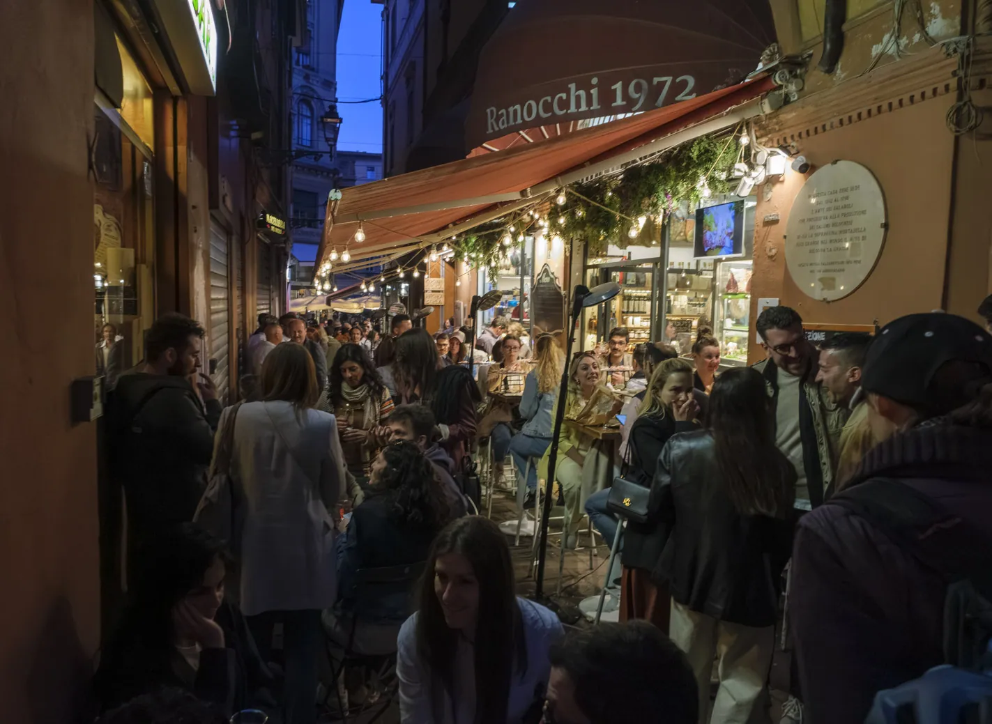May Day crowds in the alleys of the Quadrilatero, Bologna
