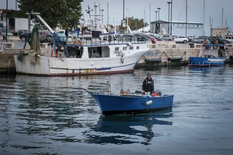 Fisherman in "Gozze" boat, Monopoli
